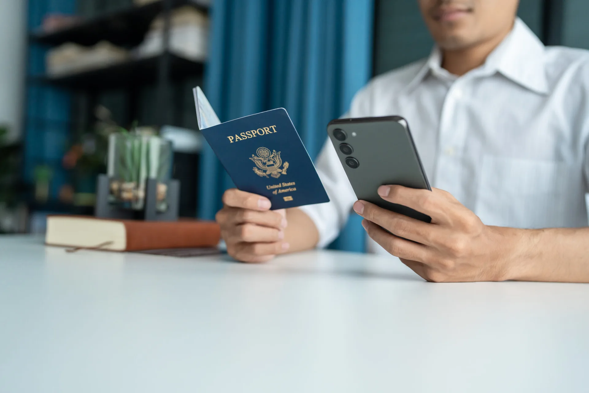 A person undergoing digital verification using a passport and mobile phone