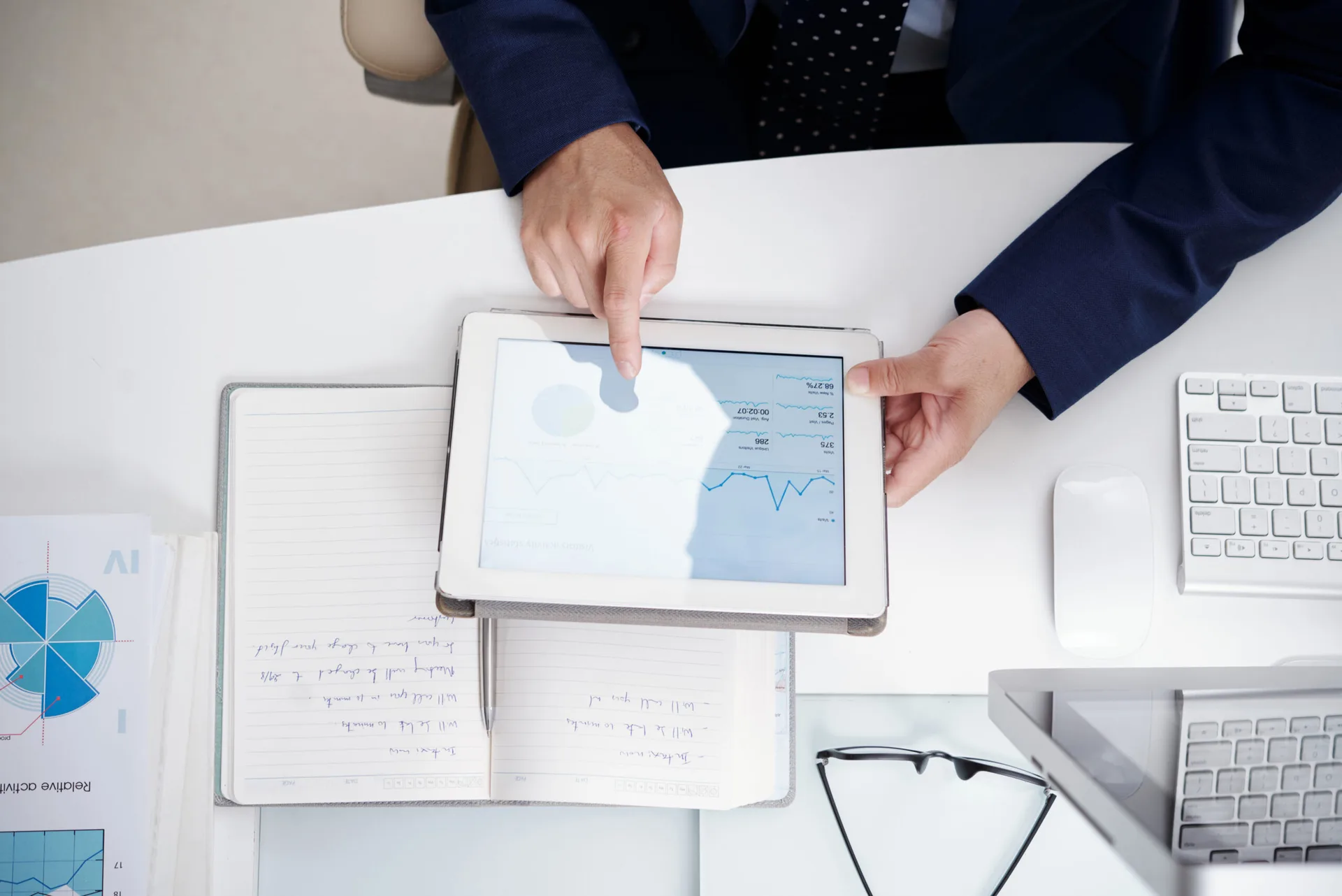 Staff member processing data on tablet device